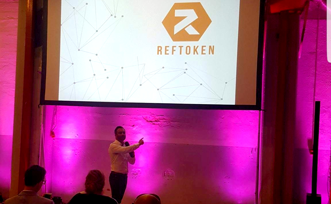 Jan CEO RefToken speaking at blockchain conference